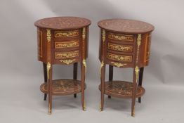 A GOOD PAIR OF LOUIS XVITH DESIGN OVAL BEDSIDE TABLES fitted with three drawers, gilt mounts,