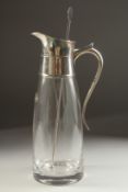 A PLAIN GLASS LEMONADE JUG with silver mount and handle. London 1979.