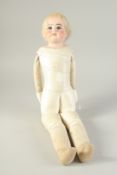 A GERMAN PORCELAIN HEADED GIRL DOLL with leather articulated body. 22ins long.