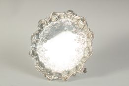 A GOOD GEORGE III SILVER PIE CRUST SALVER with shell borders on three pad feet. 7ins diameter.