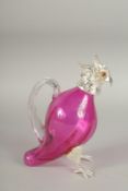 A SMALL CRANBERRY GLASS AND SILVER PLATED COCKATOO JUG. 6.5ins