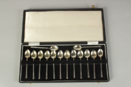 A SET OF FOURTEEN STERLING SILVER CASED COFFEE SPOONS. Birmingham 1935