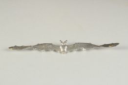 A SILVER BAT SHAPED BROOCH.