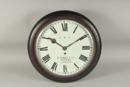 A REPLICA FUSEE MAHOGANY CIRCULAR WALL CLOCK. 12ins incl. dial.