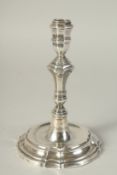 A GEORGE III CAST SILVER CANDLESTICK. 6.5ins high, only maker's mark.