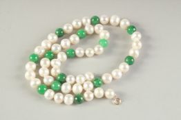 A PEARL AND JADE BEAD NECKLACE. 16ins long.