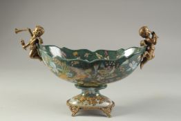 A PORCELAIN PEDESTAL BOWL WITH CUPID MOUNTS. 12ins long.