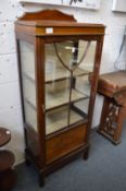 A mahogany display cabinet.