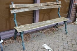 A metal and wooden slatted garden bench.