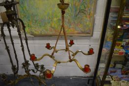 A brass six branch chandelier.