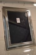 A silver photograph frame, photo size 8