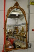 A small gilt framed mirror.