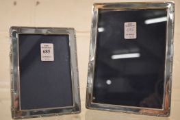 Two silver photograph frames with reeded borders, photo sizes 7