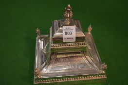 A silver presentation inkwell.