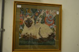 A wool work picture and a decorative print.