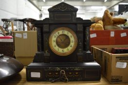 A Victorian slate mantel clock.
