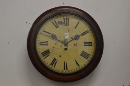 A mahogany cased circular wall clock.