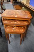 An inlaid nest of three tables.