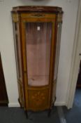 A French style vitrine with inlaid decoration.