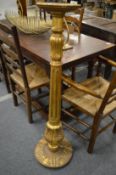 A gilt wood torchere.