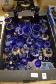 A quantity of blue glassware to include numerous enamelled jars etc.