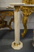 A good pair of cream marble columns with octagonal tops and bases.