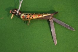 An unusual Islamic twin bladed pen knife modelled as a bird.