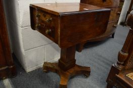 A 19th century rosewood drop-leaf work table with two drawers to one end.