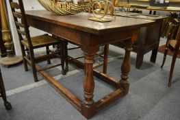 An oak refectory dining table.