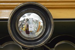 Three small convex mirrors.