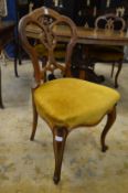 A set of four Victorian walnut dining chairs with cabriole front legs.