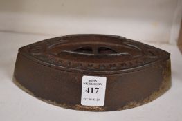 A cast iron flat iron.