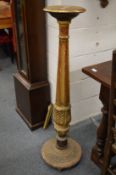 A gilt wood torchere.