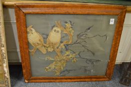 A Victorian embroidered picture of owls on a branch.