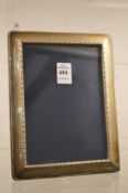 A silver photograph frame, photo size 6¾