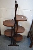 An Edwardian mahogany five-tier folding cake stand.