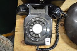 An early wall mounted phone together with camera equipment.