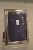 A silver photograph frame, photo size 8