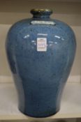 A large Chinese blue ground vase.