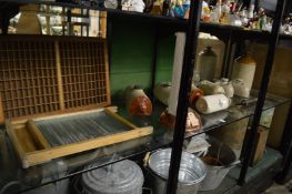 Collection of old stone hot water bottles and other bygones to include a wash board.