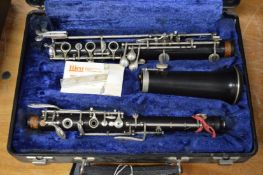A cased oboe.
