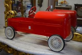 A good repainted metal peddle car.