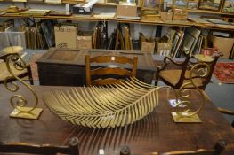 An unusual large bronze leaf shaped dish and a pair of heavy brass candlesticks.