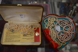 A quantity of pearl necklaces.