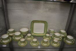 A Wedgwood part tea and coffee service with green and gilt bands.