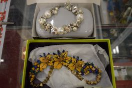 Two decorative designer necklaces.