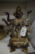 An Eastern cast metal figure of a multi-armed deity.