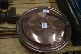 A copper bed warming pan, parts of an oak sideboard.