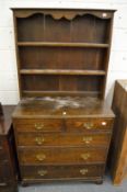 A small oak dresser with secretaire style drawer.