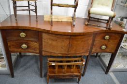A large George III mahogany serpentine fronted sideboard.
